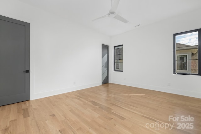 spare room with ceiling fan and light hardwood / wood-style floors