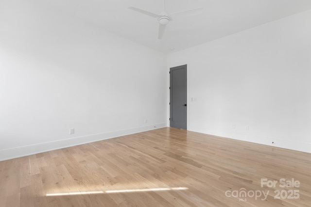 spare room featuring ceiling fan and light hardwood / wood-style floors