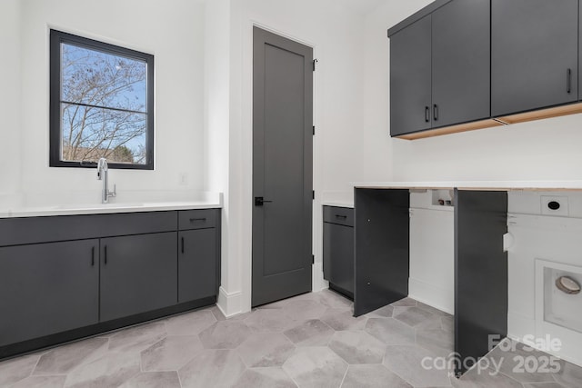 interior space featuring sink and gray cabinets