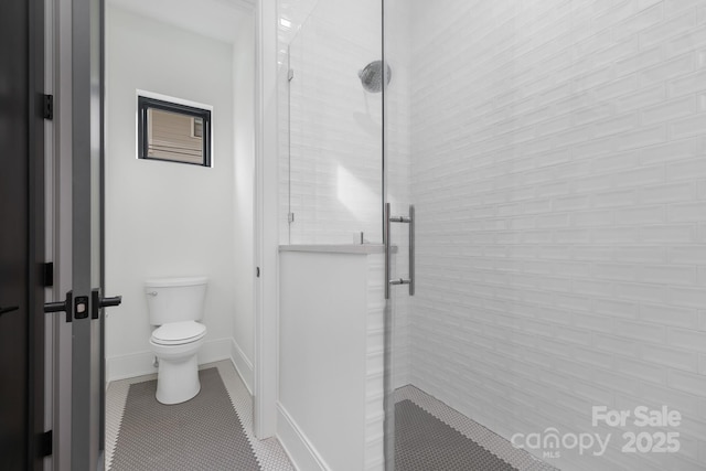 bathroom featuring walk in shower, toilet, and tile patterned flooring