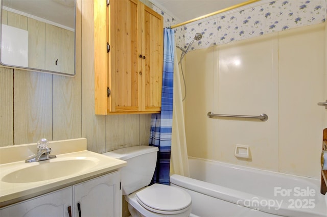 full bathroom featuring crown molding, wooden walls, vanity, shower / bath combination with curtain, and toilet