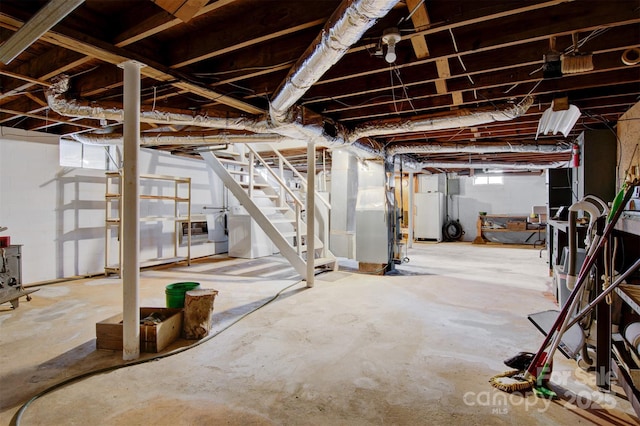 basement with heating unit and washing machine and clothes dryer