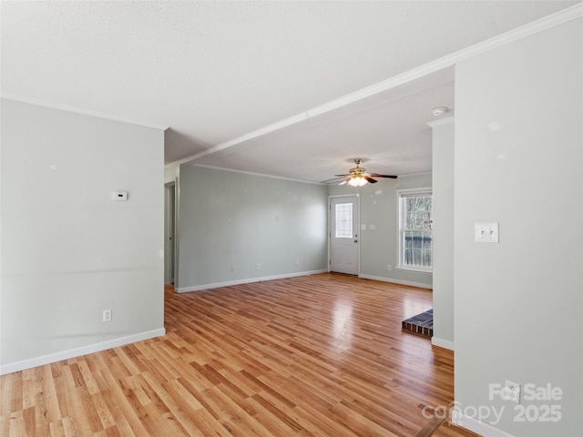 unfurnished room with light hardwood / wood-style flooring, ornamental molding, and ceiling fan