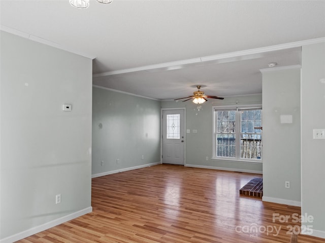 interior space featuring ornamental molding, ceiling fan, and light hardwood / wood-style floors