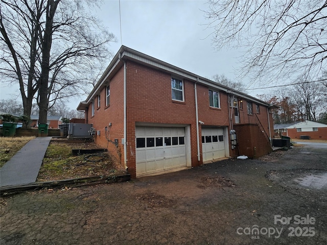 3103 Minnesota Rd, Charlotte, NC 28208 - view of side of home with a garage and central AC