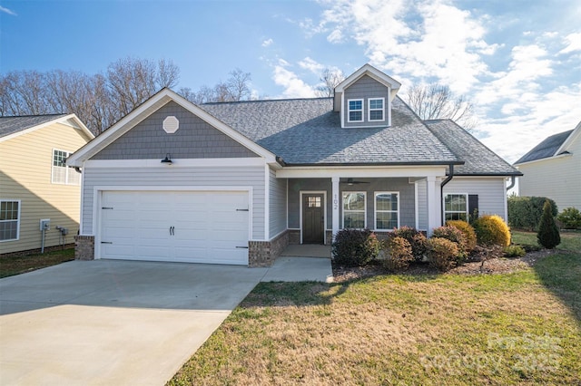 view of front of house with a garage and a front yard