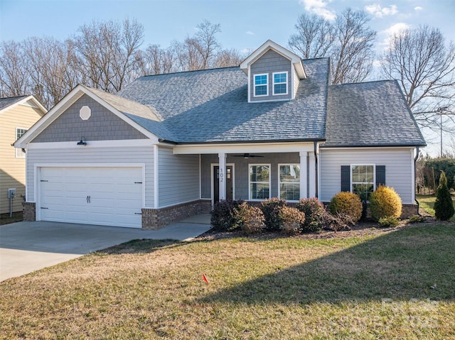 view of front facade with a garage and a front yard