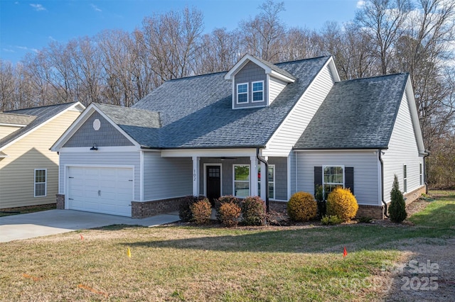 cape cod home with a garage and a front yard