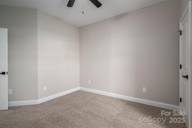 spare room featuring ceiling fan and carpet flooring