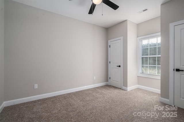 unfurnished bedroom featuring light carpet and ceiling fan