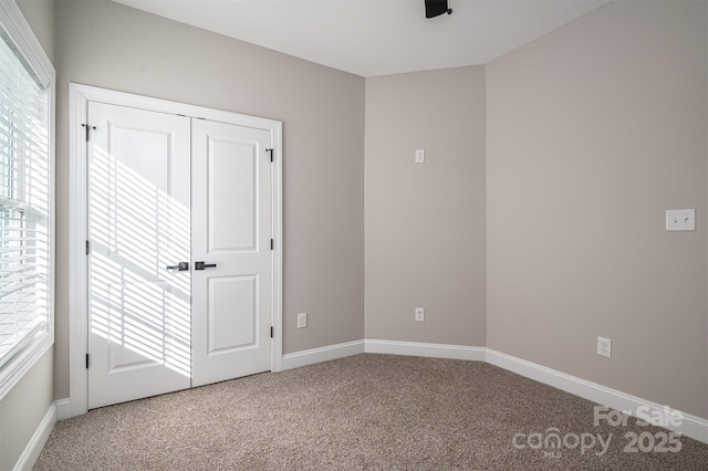 unfurnished bedroom with carpet floors