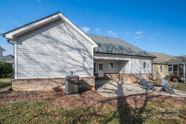 back of house with a patio, cooling unit, and a fire pit