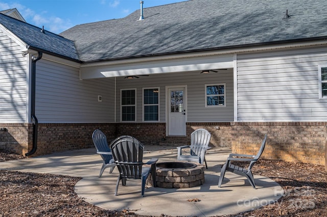 view of patio / terrace featuring ceiling fan and an outdoor fire pit