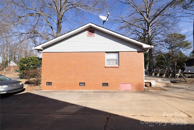 view of side of property with a patio