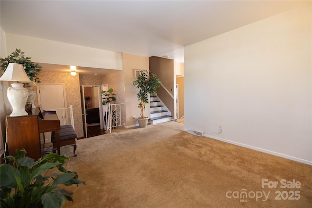 unfurnished living room with light colored carpet