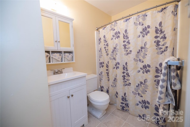 bathroom featuring a shower with curtain, vanity, toilet, and tile patterned flooring