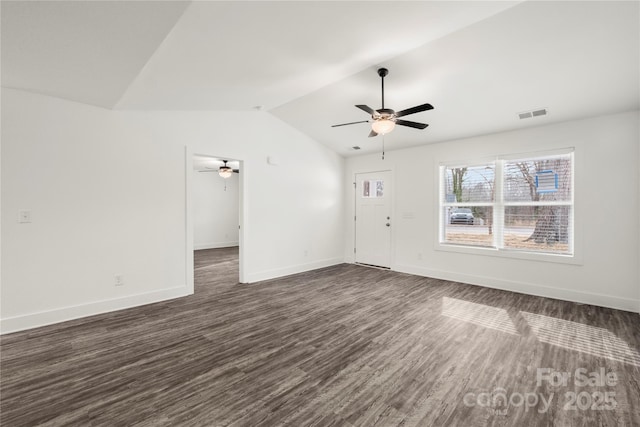 unfurnished living room featuring vaulted ceiling, dark wood-type flooring, and ceiling fan