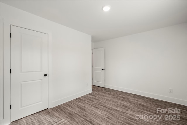 empty room featuring hardwood / wood-style flooring