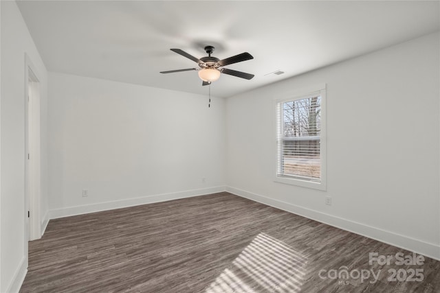 unfurnished room featuring dark hardwood / wood-style flooring and ceiling fan