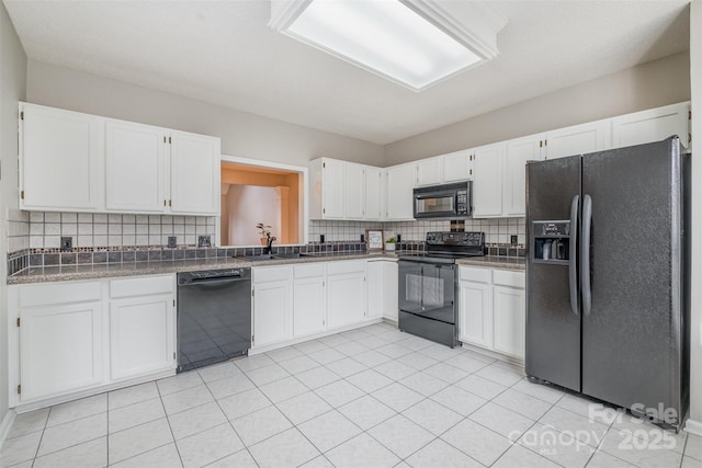 kitchen with white cabinetry, backsplash, sink, and black appliances