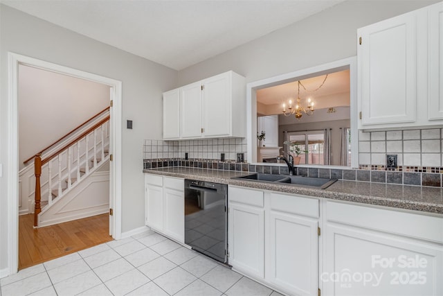 kitchen with white cabinetry, dishwasher, sink, and light tile patterned floors