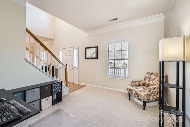 sitting room featuring crown molding and carpet flooring