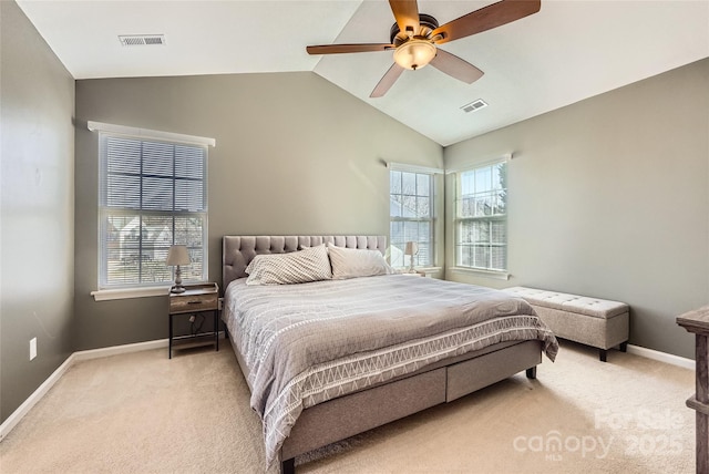 bedroom with lofted ceiling, light colored carpet, and ceiling fan