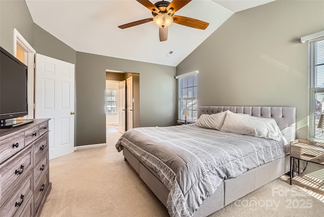 carpeted bedroom with high vaulted ceiling and ceiling fan