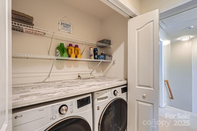 clothes washing area with washer and dryer