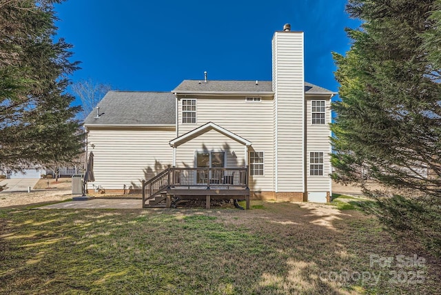 rear view of property featuring cooling unit, a yard, a patio, and a deck