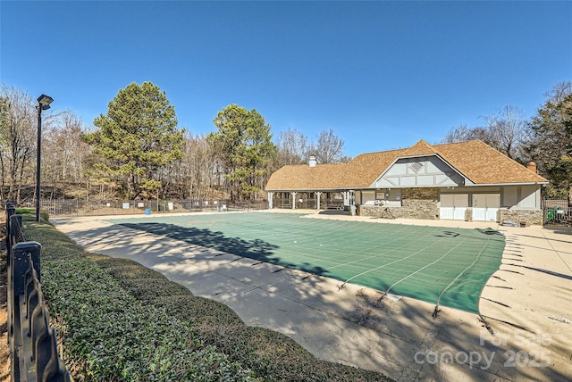 view of swimming pool featuring a patio area