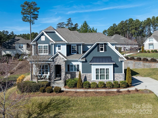 craftsman-style home with a front yard