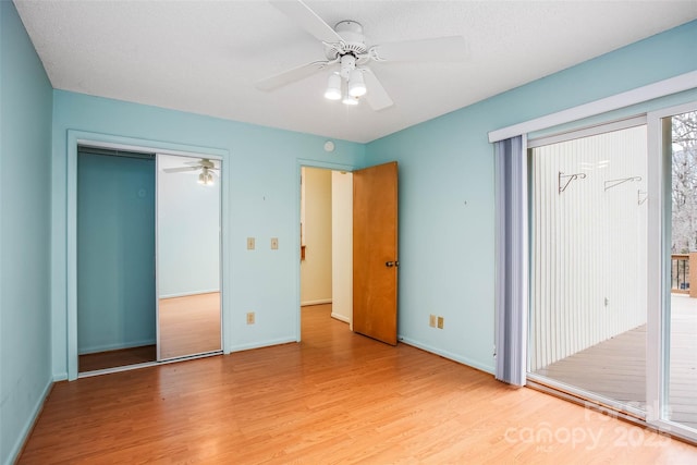 unfurnished bedroom with a closet, ceiling fan, and light hardwood / wood-style flooring