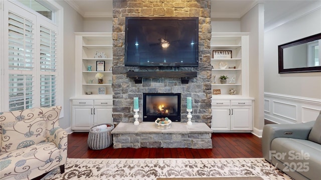 living room featuring ornamental molding, dark hardwood / wood-style floors, and built in features