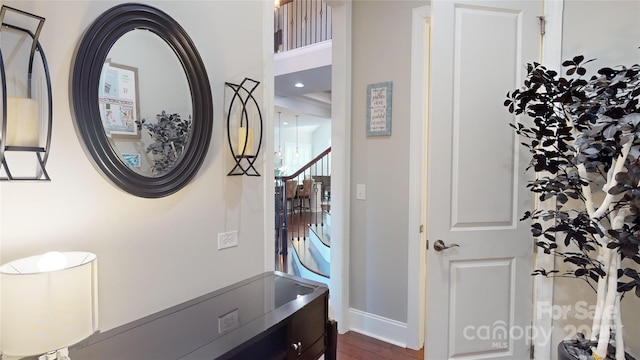 entryway with baseboards and dark wood-style floors