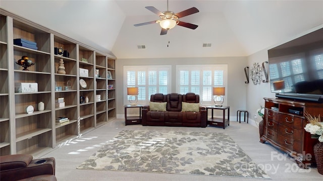 living area with visible vents, baseboards, light colored carpet, and ceiling fan