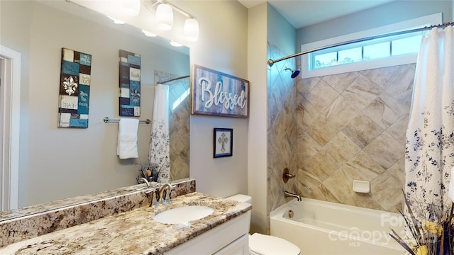 bathroom with shower / bath combination with curtain, vanity, and toilet