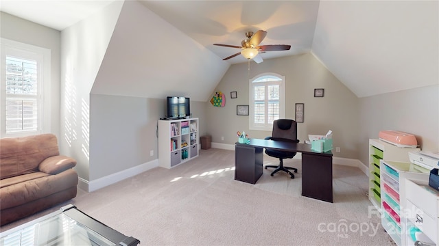 office space featuring ceiling fan, lofted ceiling, and light carpet