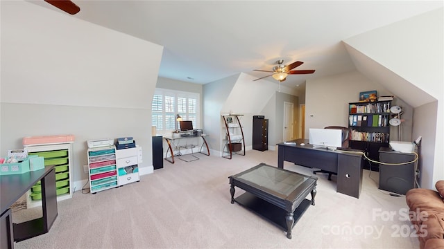 carpeted home office featuring vaulted ceiling, baseboards, and ceiling fan