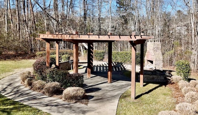 exterior space featuring an outdoor stone fireplace