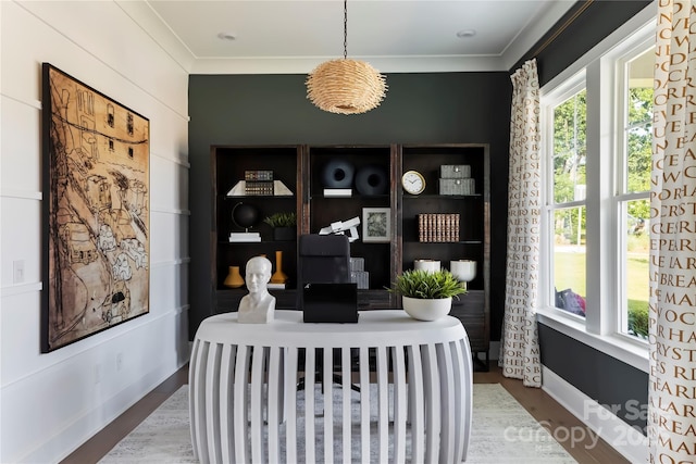 office featuring crown molding, hardwood / wood-style flooring, and a healthy amount of sunlight