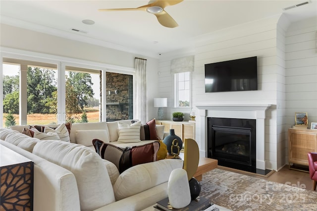 living room featuring hardwood / wood-style floors and ceiling fan