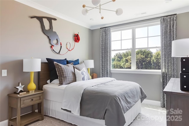 carpeted bedroom featuring crown molding and a notable chandelier