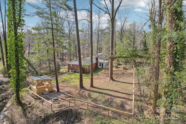 view of yard featuring a wooded view