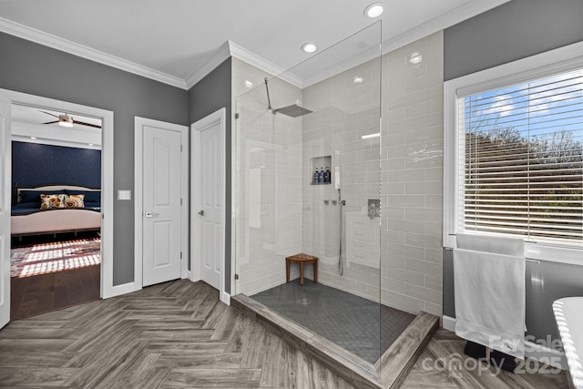 bathroom with ornamental molding, tiled shower, parquet floors, and ceiling fan