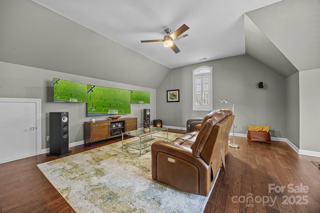 living room featuring vaulted ceiling, ceiling fan, and dark hardwood / wood-style flooring