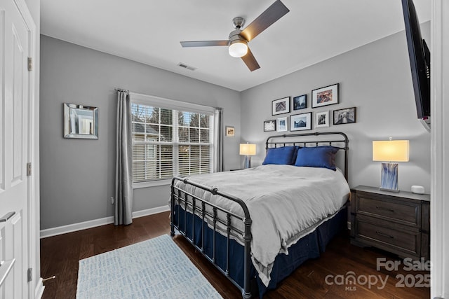 bedroom with dark wood-type flooring and ceiling fan