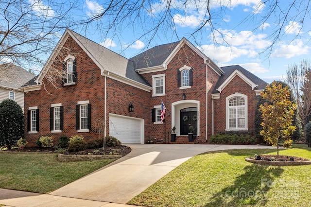 view of property featuring a garage and a front yard