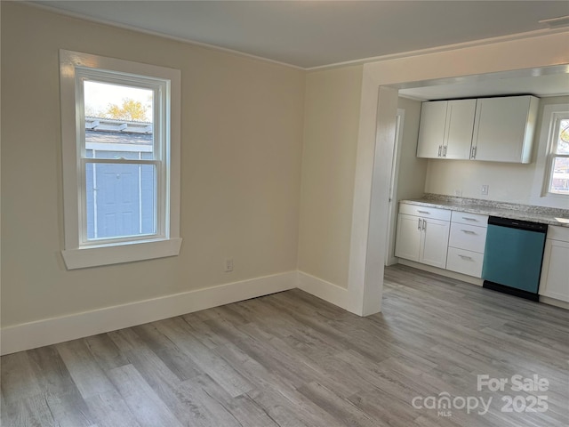 kitchen featuring light hardwood / wood-style flooring, dishwasher, white cabinetry, light stone countertops, and ornamental molding