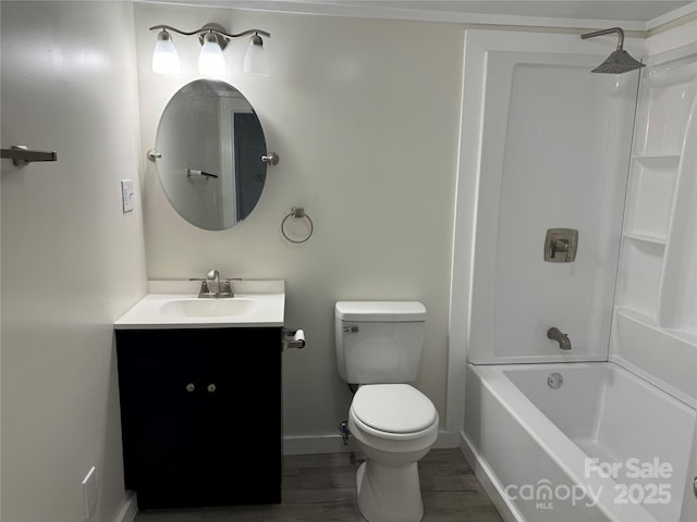 full bathroom featuring hardwood / wood-style flooring, vanity, toilet, and tub / shower combination